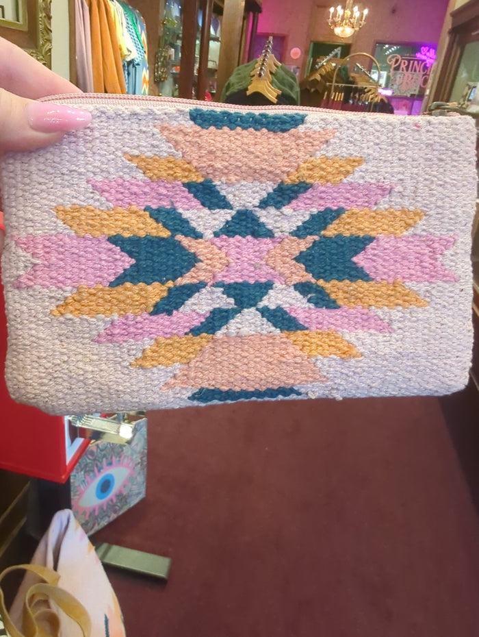 Pink and orange Aztec wristlet bag by Panache Apparel Co. with woven fabric and wrist strap, perfect for casual outings.