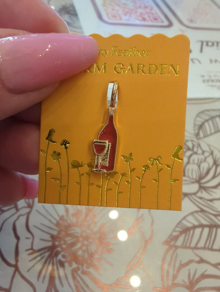 Lucky Feather Charm Garden Wine Gold charm featuring a detailed wine glass design.