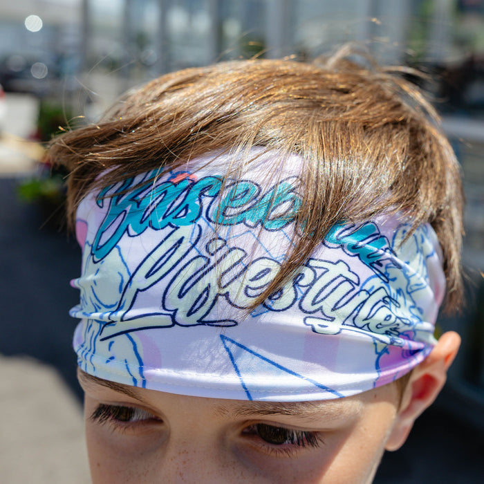 Adult model wearing headband with "Fastball Scoops Headband" design