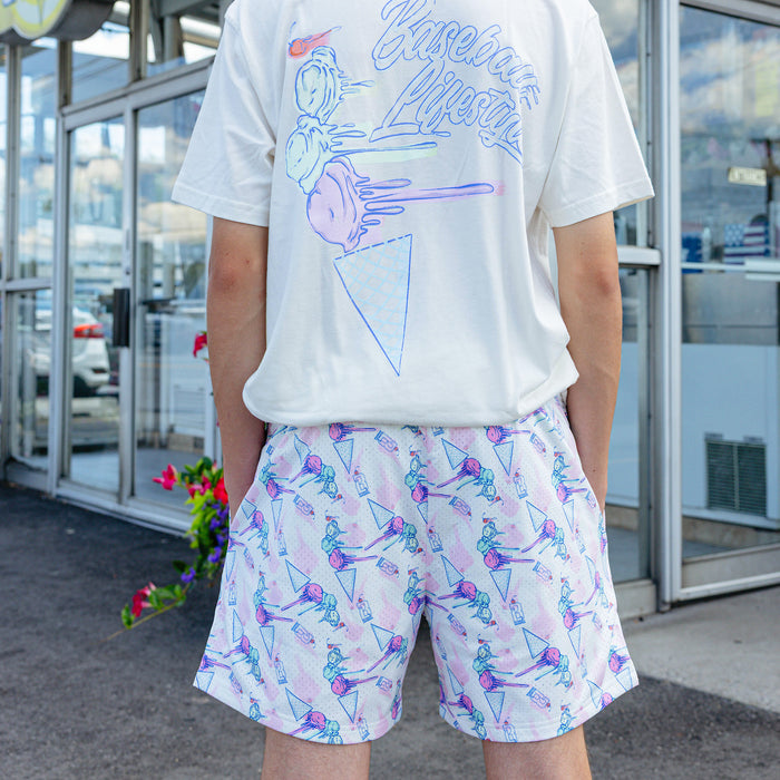 Adult model wearing shorts with "Fastball Scoops" design