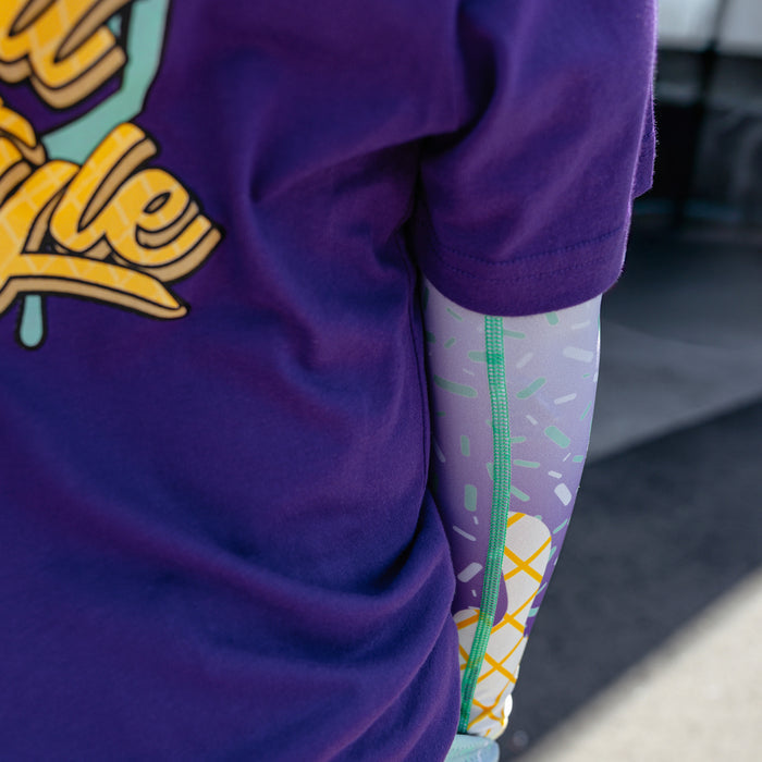 Youth model wearing ice Cream Arm Sleeve Purple Mint youth sleeve
