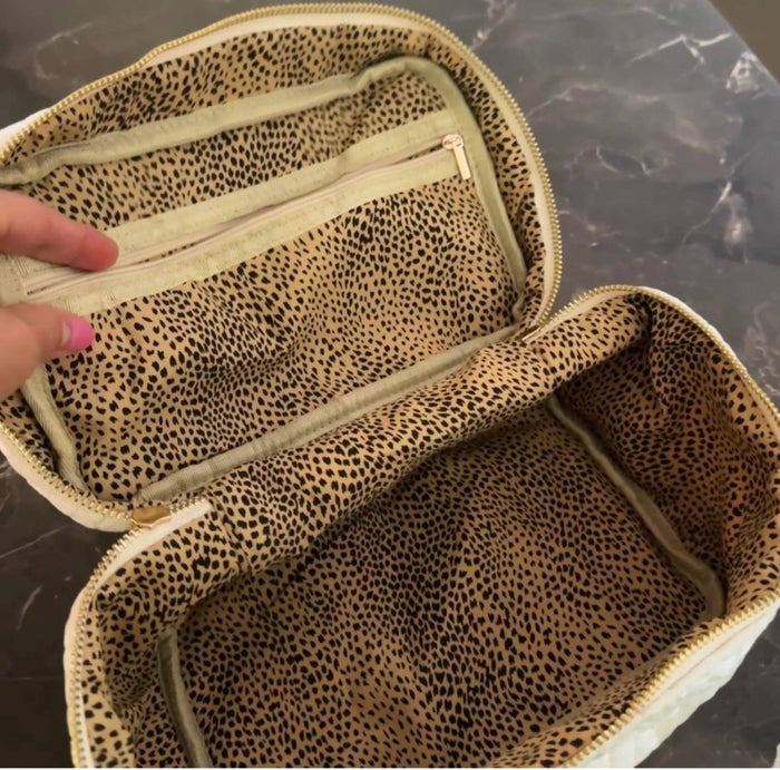 Ellison+Young quilted velvet vanity case with zipper closure, padded interior, and compact design for travel storage.
