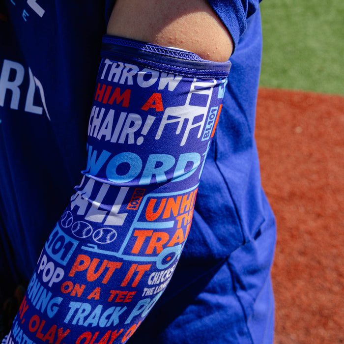 Adult model wearing multi-color arm sleeve with "Trash Talk" design