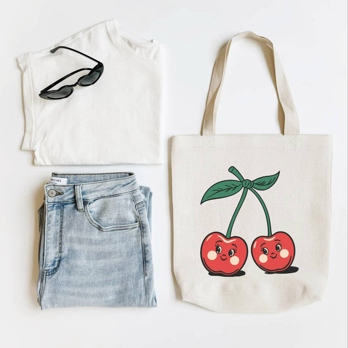 Mugsby vintage cherry tote bag with leather handles and spacious interior, featuring a classic cherry print design.