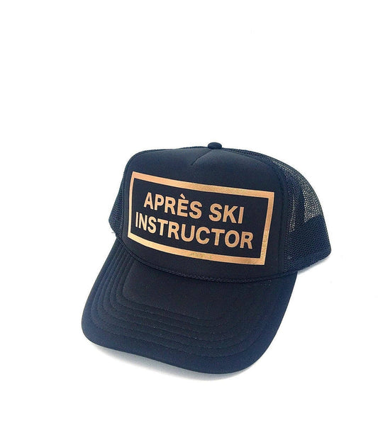 Après Babe Après Ski Instructor Trucker Hat with mesh back and embroidered patch, casual winter accessory for outdoor activities.