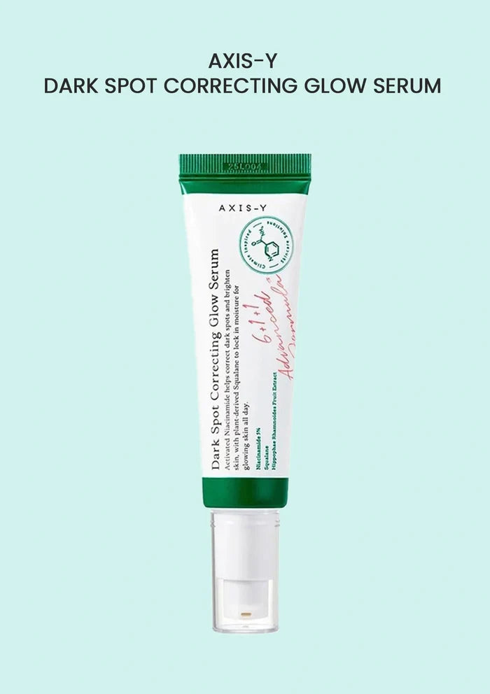 Axis-Y dark spot correcting glow serum tube on a light blue background