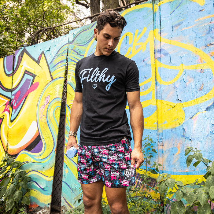 Adult model wearing multi-color shorts with “Baseball Lifestyle Tag” design