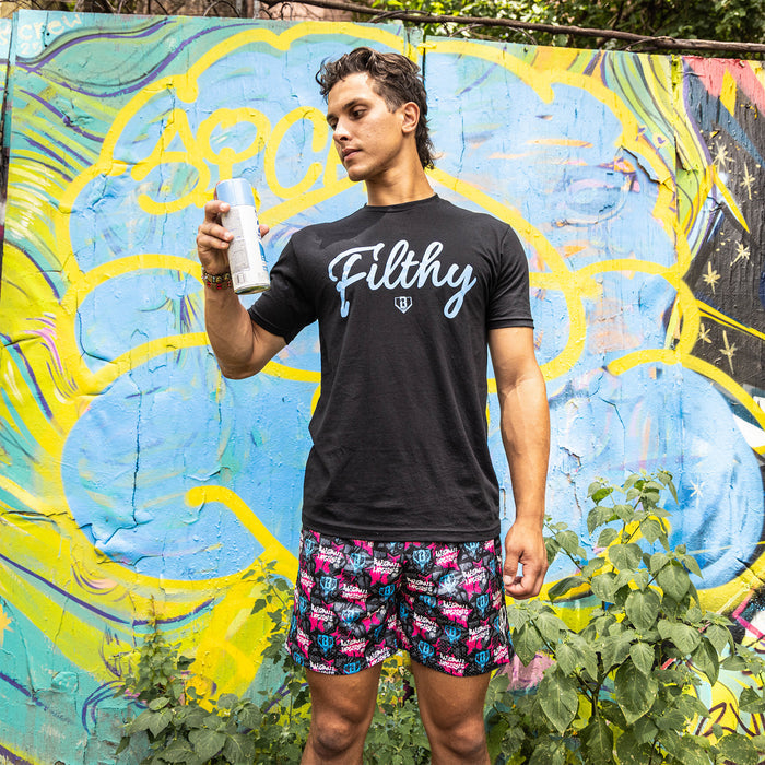 Adult model wearing multi-color shorts with “Baseball Lifestyle Tag” design
