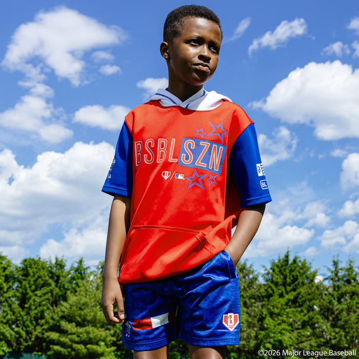 Youth model wearing Red, White & Blue youth shorts with "BL101 All-Star Game" design