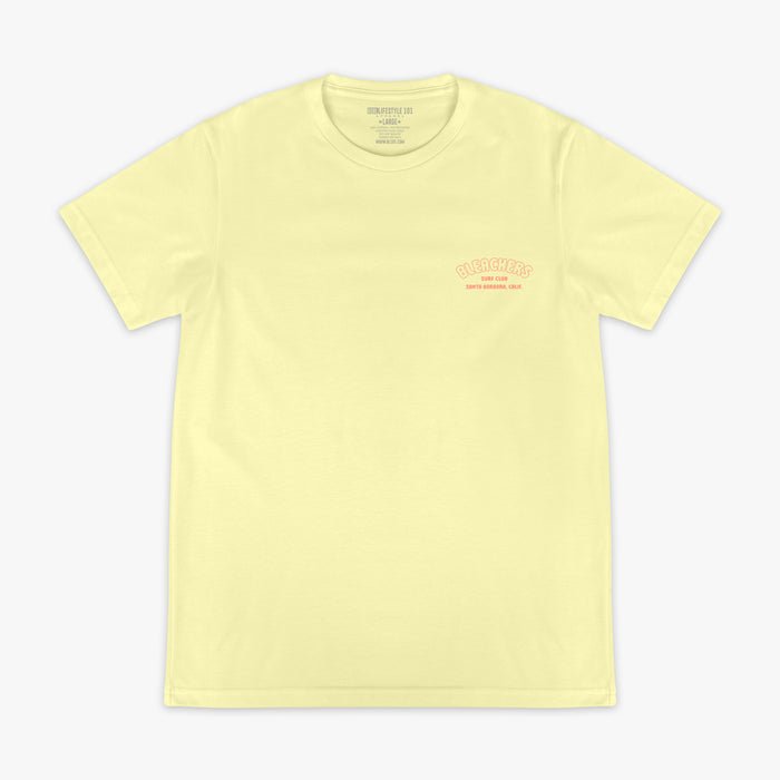 Yellow graphic tee with "Bleachers Surf Club" design — front view