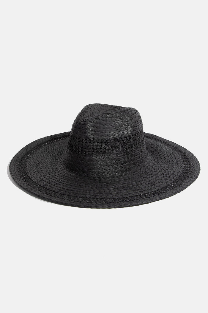 Boho flat brim straw hat from Collections by Fame Accessories featuring a wide brim and woven straw design.