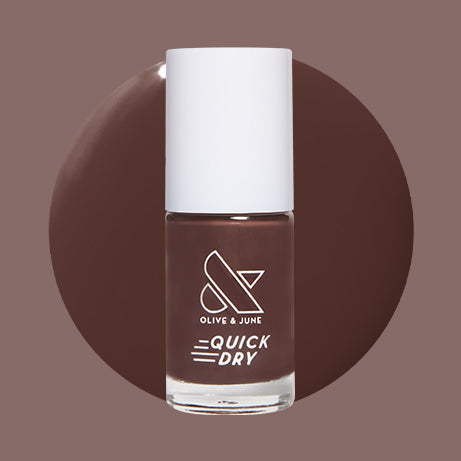 Bunny deep neutral brown quick dry gel polish bottle with Olive and June logo on muted brown background