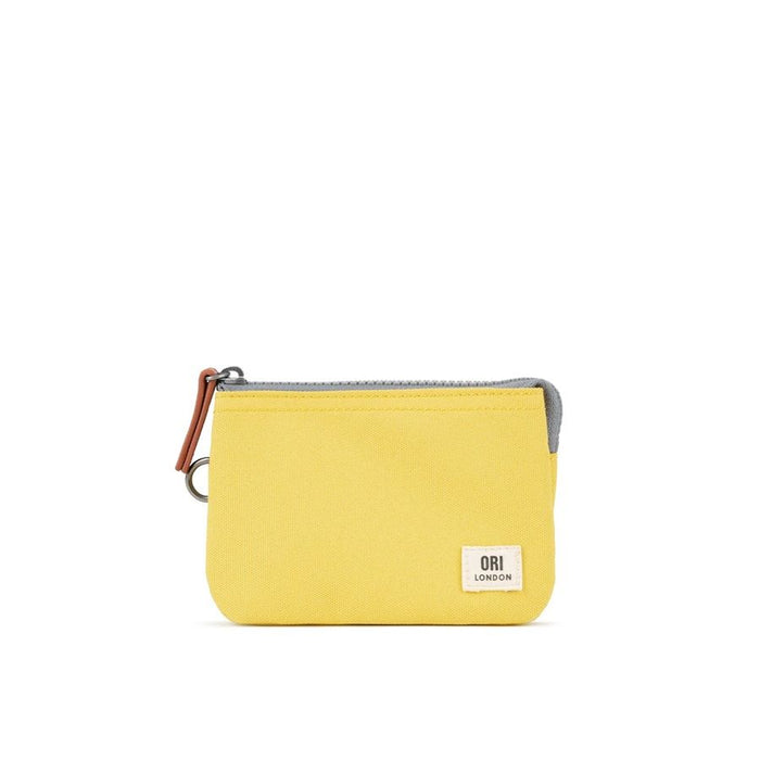 Small yellow canvas zip pouch with ORI LONDON label and metal zipper pull