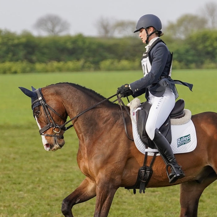 Premium white competition breeches with a Full Silicone seat. Stretch high waisted Jodhpurs. Deep pockets, supportive, comfortable and compression quality fabric. Elegant detailing with subtle leg logo branding.