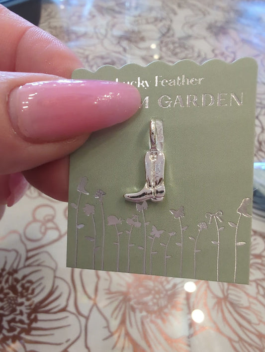 Silver cowboy boot charm from Lucky Feather's Charm Garden collection, detailed with western-style design and intricate accents.