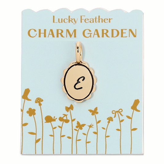 Gold scalloped initial charm from Lucky Feather's Charm Garden collection, featuring a stylish letter E on a delicate charm.
