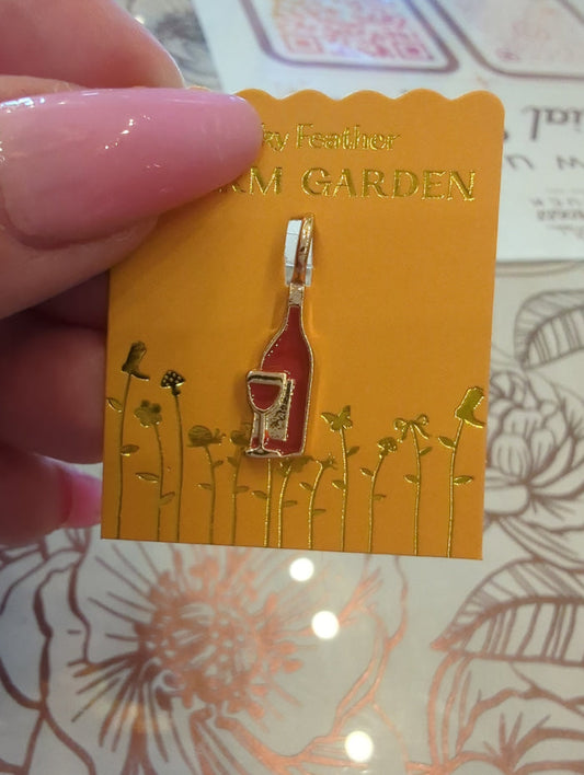 Lucky Feather Charm Garden Wine Gold charm featuring a detailed wine glass design.