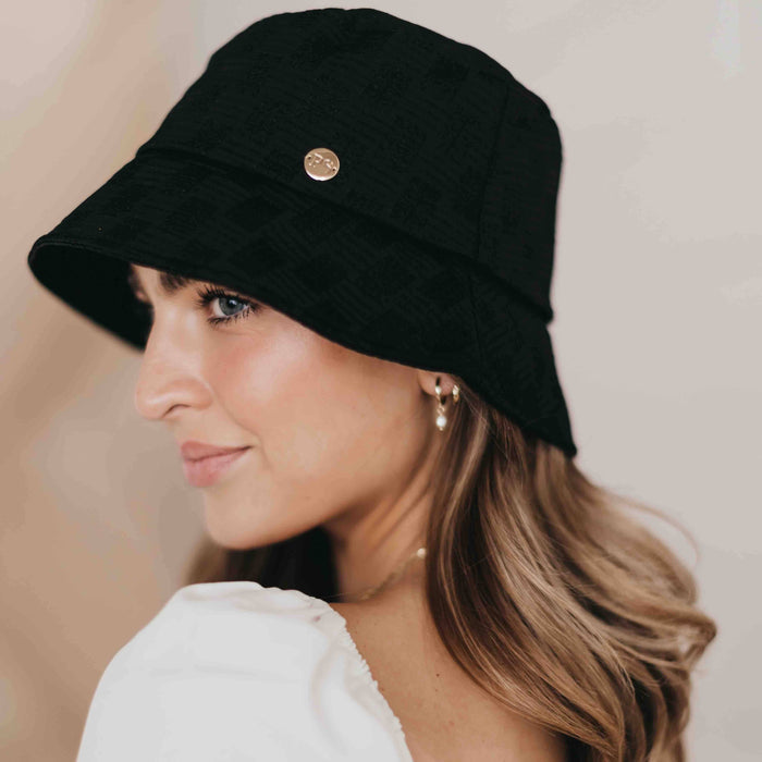 Pretty Simple Clearwater Bucket Hat shown in natural fabric with wide brim, perfect for sun protection and casual style.