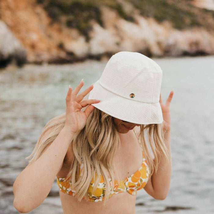 Pretty Simple Clearwater Bucket Hat in neutral fabric with a wide brim, perfect for sun protection and casual style.