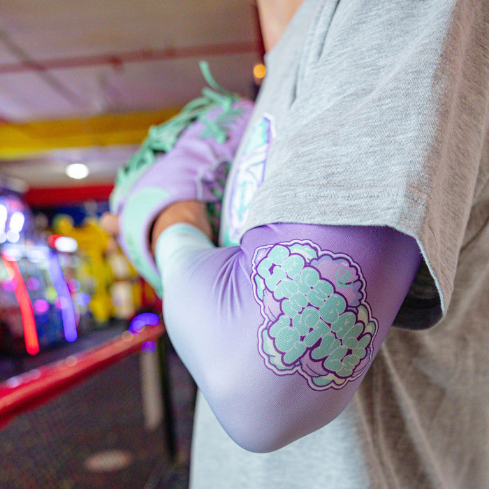 Youth model wearing Cotton Candy Galaxy Grape youth arm sleeve