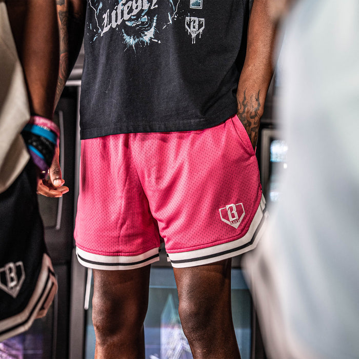 Adult model wearing red Court Azalea shorts