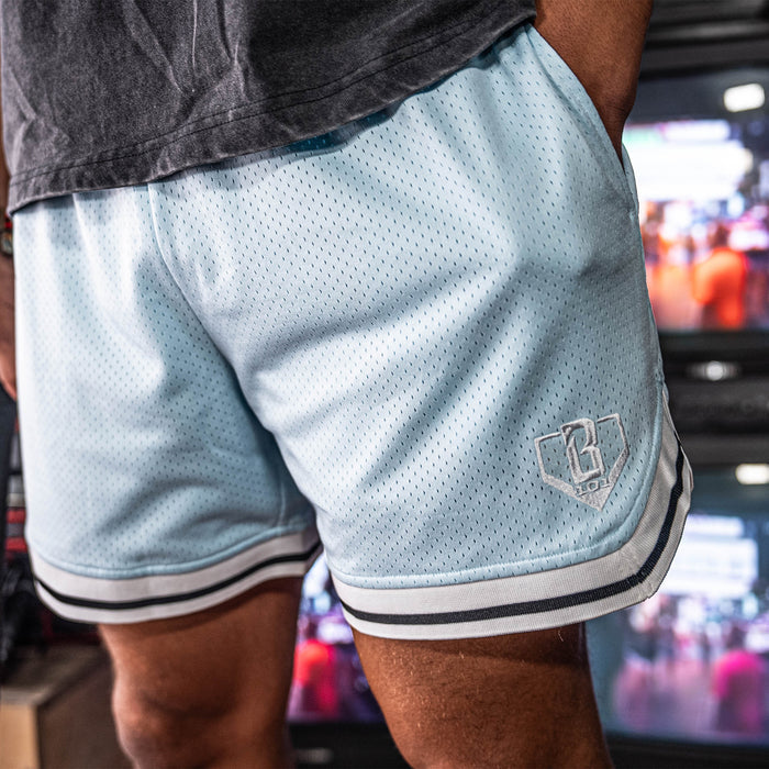 Adult model wearing blue Court Powder Blue shorts