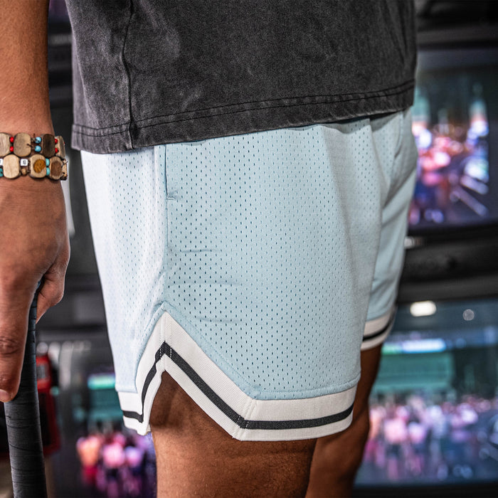 Adult model wearing blue Court Powder Blue shorts
