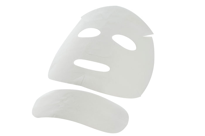 An unwrapped CRYSTAL CARBOXY MASK showcasing the cotton sheet mask ready for application. This visual represents the imported face mask experience from Stayve Korean Masks and Tok Tok Mask.