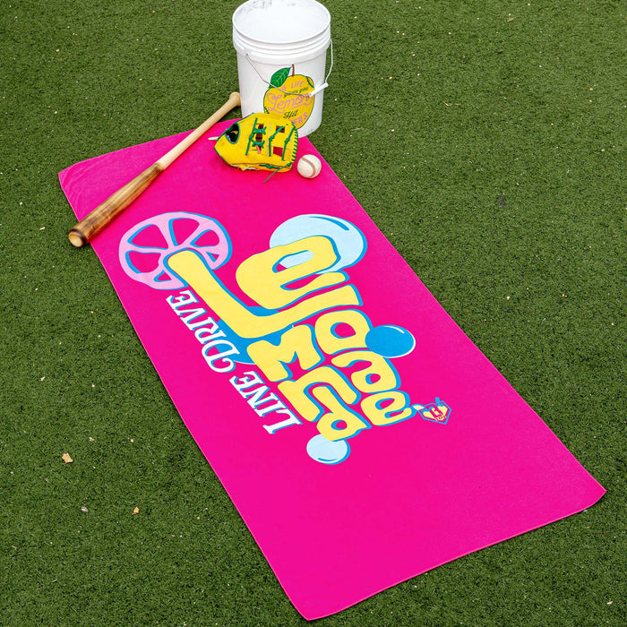 Adult model wearing pink towel with "Electric Lemonade" design