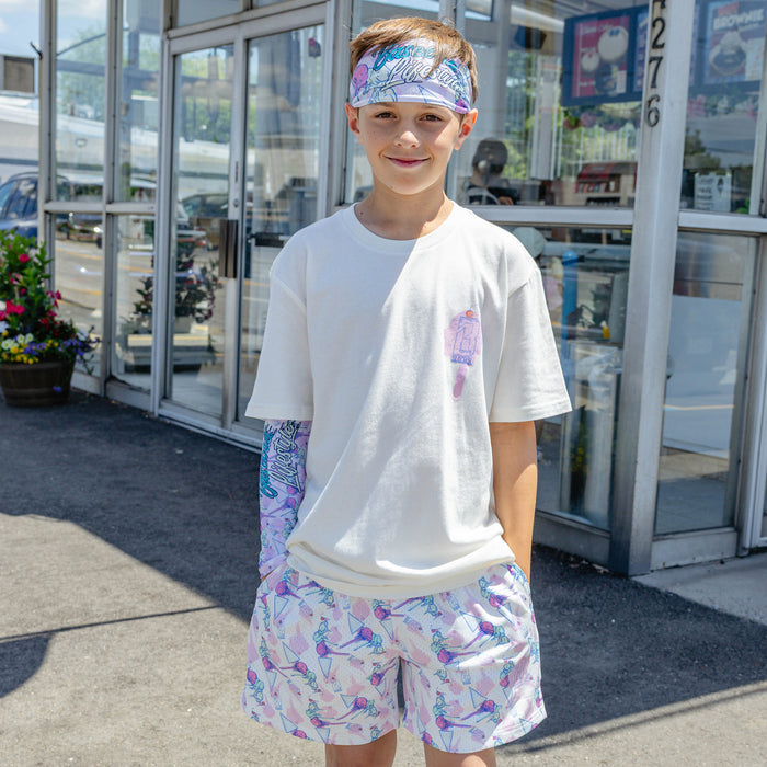 Youth model wearing youth sleeve with "Fastball Scoops Arm Sleeve" design