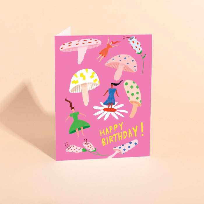 Birthday card with colorful mushroom illustration and "Happy Birthday!" text