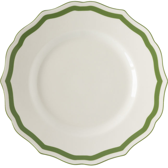 White plate with a green rim on a white background.