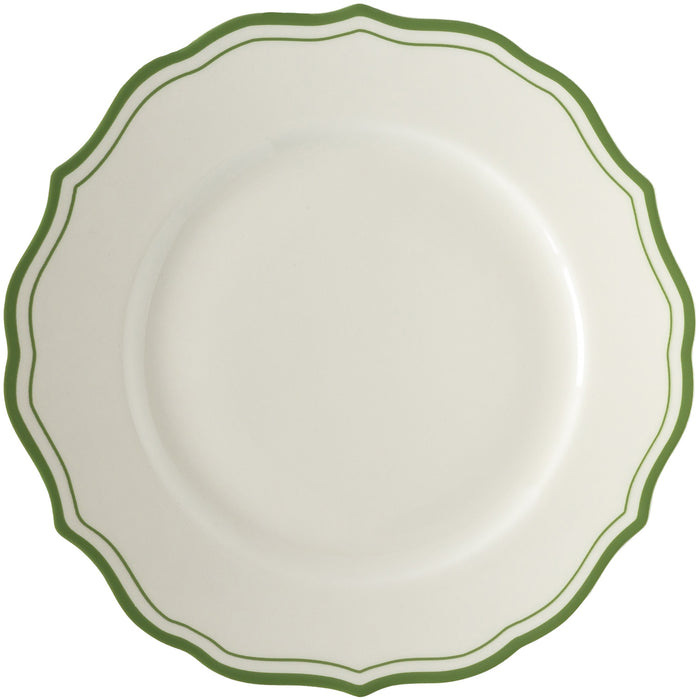 White plate with green rim on a white background.