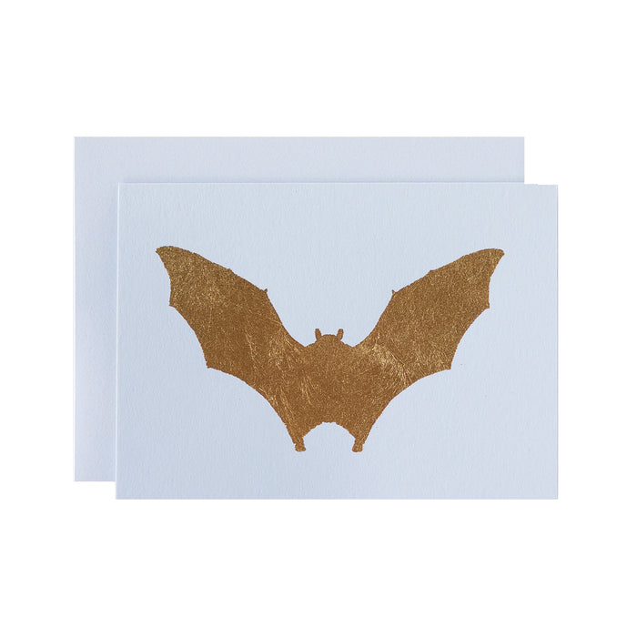 A gold foiled bat in flight, on a light grey card with a matching envelope.
