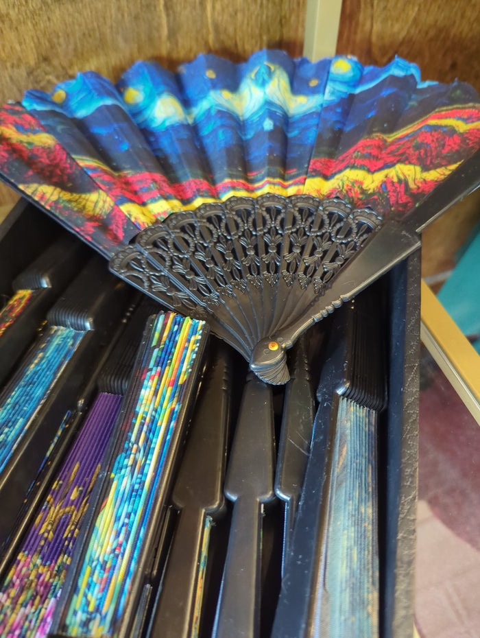 Joia hot flash handfan with colorful floral design, compact handheld fan perfect for cooling on the go