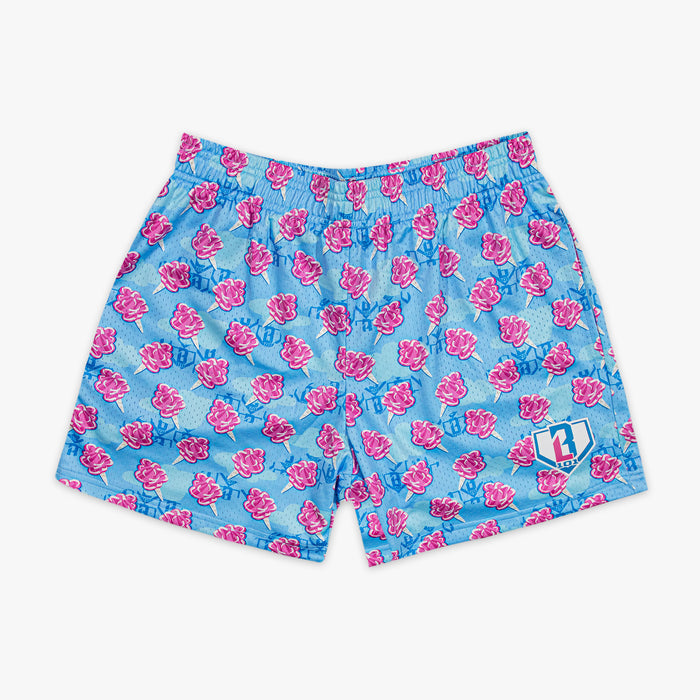 Blue shorts with pink cotton candy pattern on a white background
