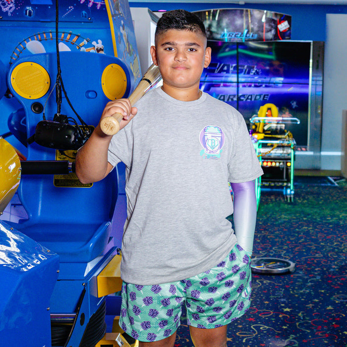 Youth model wearing Home Run Sugar Galaxy Grape youth shorts