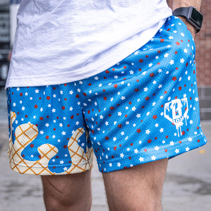 Adult model wearing blue Ice Cream USA shorts