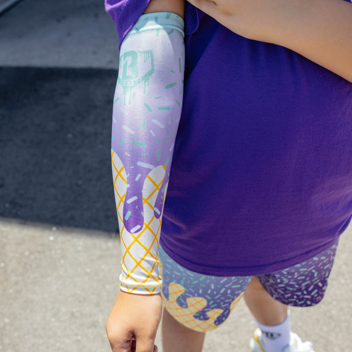 Youth model wearing ice Cream Arm Sleeve Purple Mint youth sleeve