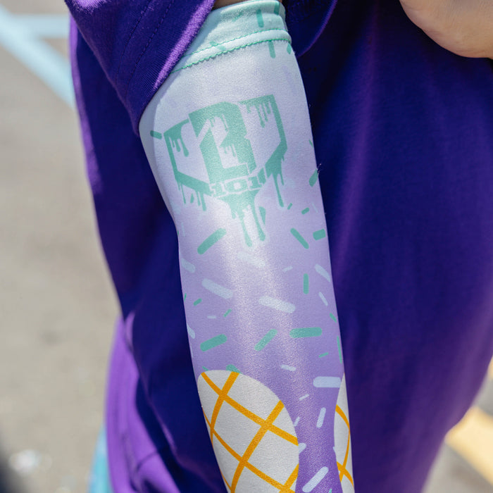Youth model wearing ice Cream Arm Sleeve Purple Mint youth sleeve