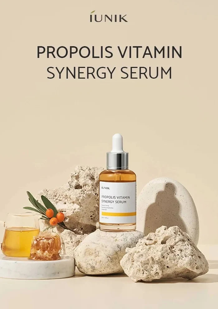 Propolis Vitamin Synergy Serum bottle with natural elements on a beige background
