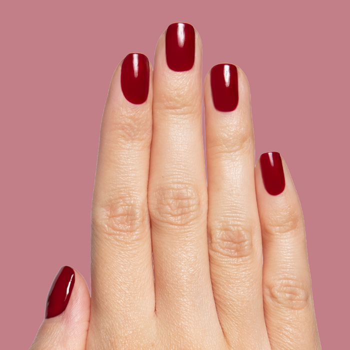 Jammy quick dry gel polish in rich cabernet shade on natural medium-length nails with smooth glossy finish