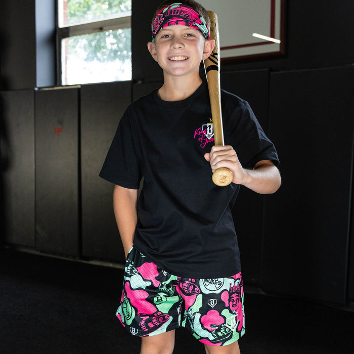Youth model wearing black shorts with "King Of JUCO" design