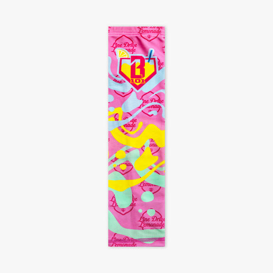 Adult model wearing pink arm sleeve with "Lemon Burst" design