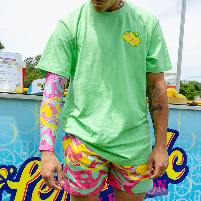 Adult model wearing pink arm sleeve with "Lemon Burst" design