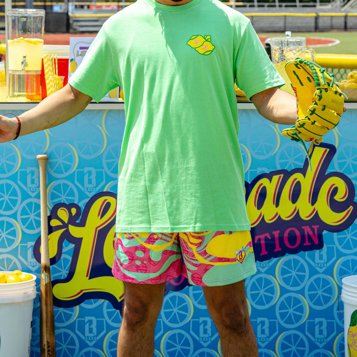 Adult model wearing multi-color shorts with "Lemon Burst" design