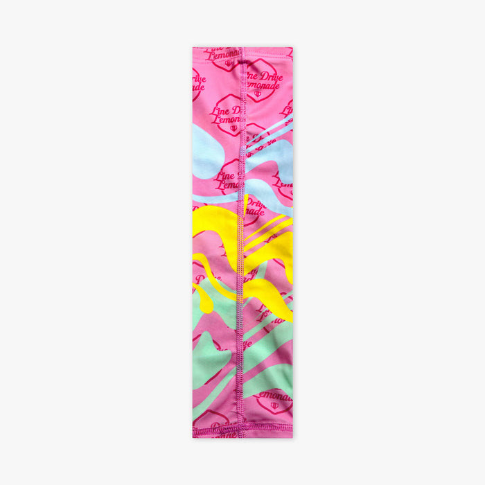 Youth model wearing pink youth arm sleeve with "Lemon Burst" design