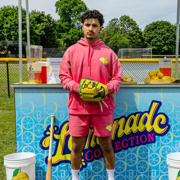 Adult model wearing pink shorts with "Lemon Dingers" design