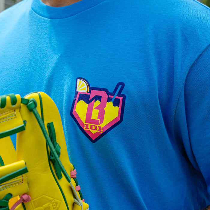 Adult model wearing blue graphic tee with "Lemonade" design