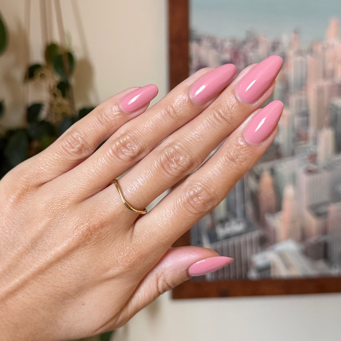 Lovely gel polish in muted dusty rose shade on almond shaped nails with a smooth, glossy quick dry finish